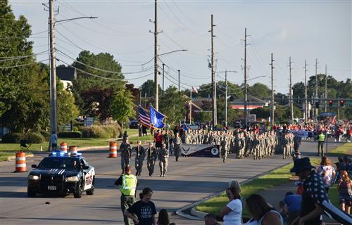 Lead  processional of parade with police car out front